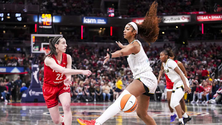 May 17, 2025; Indianapolis, IN, USA; Indiana Fever guard Caitlin Clark (22) passes around Chicago Sky forward Angel Reese (5) on Saturday, May 17, 2025, during a game between the Indiana Fever and the Chicago Sky at Gainbridge Fieldhouse in Indianapolis. The Indiana Fever defeated the Chicago Sky, 93-58.Mandatory Credit: Grace Smith-IndyStar via Imagn Images May 17, 2025; Indianapolis, IN, USA; Indiana Fever guard Caitlin Clark (22) passes around Chicago Sky forward Angel Reese (5) on Saturday, May 17, 2025, during a game between the Indiana Fever and the Chicago Sky at Gainbridge Fieldhouse in Indianapolis. The Indiana Fever defeated the Chicago Sky, 93-58.Mandatory Credit: Grace Smith-IndyStar via Imagn Images