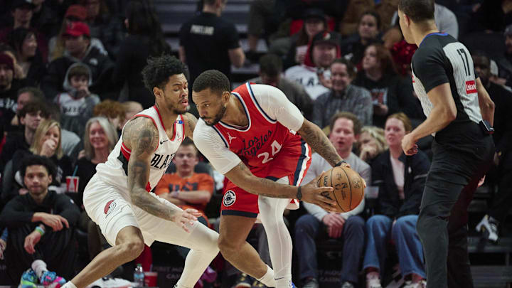 Jan 16, 2025; Portland, Oregon, USA; LA Clippers guard Norman Powell (24) looks for an opening during the second half against Portland Trail Blazers guard Anfernee Simons (1) at Moda Center. Mandatory Credit: Troy Wayrynen-Imagn Images Jan 16, 2025; Portland, Oregon, USA; LA Clippers guard Norman Powell (24) looks for an opening during the second half against Portland Trail Blazers guard Anfernee Simons (1) at Moda Center. Mandatory Credit: Troy Wayrynen-Imagn Images
