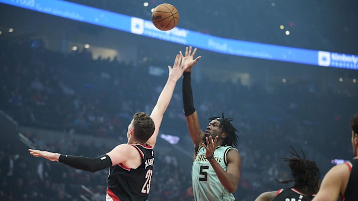 Feb 22, 2025; Portland, Oregon, USA; Charlotte Hornets center Mark Williams (5) puts up a shot during the first half against Portland Trail Blazers center Donovan Clingan (23) at Moda Center. Mandatory Credit: Troy Wayrynen-Imagn Images