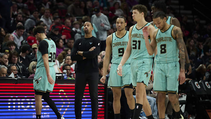 Feb 22, 2025; Portland, Oregon, USA; Charlotte Hornets head coach Charles Lee talks to an official during a time out during the second half against the Portland Trail Blazers at Moda Center. Mandatory Credit: Troy Wayrynen-Imagn Images
