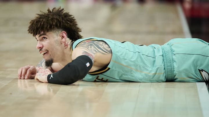 Feb 22, 2025; Portland, Oregon, USA; Charlotte Hornets guard LaMelo Ball (1) lays on the court after being fouled during the second half against the Portland Trail Blazers at Moda Center. Mandatory Credit: Troy Wayrynen-Imagn Images Feb 22, 2025; Portland, Oregon, USA; Charlotte Hornets guard LaMelo Ball (1) lays on the court after being fouled during the second half against the Portland Trail Blazers at Moda Center. Mandatory Credit: Troy Wayrynen-Imagn Images