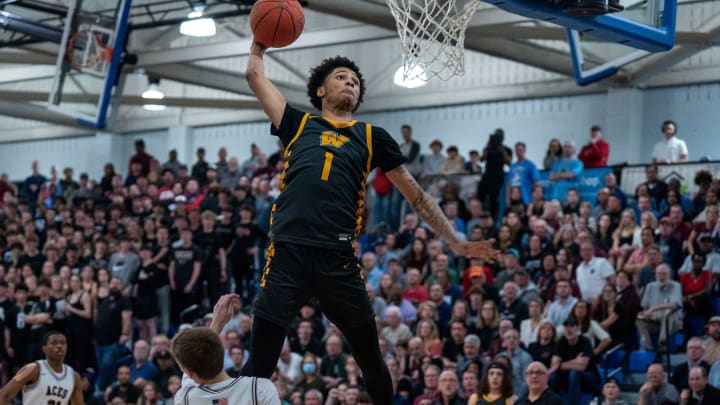 Archbishop Wood's Jalil Bethea (1) goes up for an emphatic dunk against Lower Merion's Owen McCabe (0) during a PIAA Class 6A boys second-round state playoff basketball game in Bensalem  on Wednesday, Mar. 13, 2024.