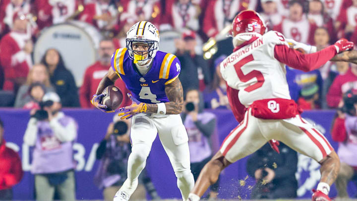 CJ Daniels (4) runs the ball as the LSU Tigers take on the Oklahoma Sooners. Nov 30, 2024; Baton Rouge, Louisiana, USA; at Tiger Stadium. CJ Daniels (4) runs the ball as the LSU Tigers take on the Oklahoma Sooners. Nov 30, 2024; Baton Rouge, Louisiana, USA; at Tiger Stadium.