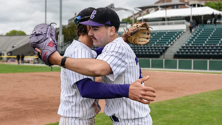 Holy Cross shortstop Jimmy King, left, hugs pitcher Danny Macchiarola after defeating Army 12-1 on Sunday May 18, 2025 at Fitton Field in Worcester.