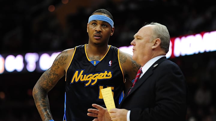 Feb. 18, 2010; Cleveland, OH, USA; Denver Nuggets forward Carmelo Anthony (15) talks with coach George Karl during the game against the Cleveland Cavaliers at Quicken Loans Arena. Mandatory Credit: Andrew Weber-Imagn Images Feb. 18, 2010; Cleveland, OH, USA; Denver Nuggets forward Carmelo Anthony (15) talks with coach George Karl during the game against the Cleveland Cavaliers at Quicken Loans Arena. Mandatory Credit: Andrew Weber-Imagn Images