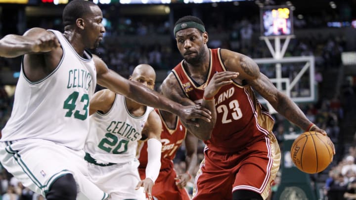 Apr 4, 2010; Boston, MA, USA; Cleveland Cavaliers forward LeBron James (23) drives the ball past Boston Celtics center Kendrick Perkins (43) during the 2nd half at the TD Banknorth Garden. The Celtics defeated the Cavaliers  117-113. Mandatory Credit: David Butler II-USA TODAY Sports