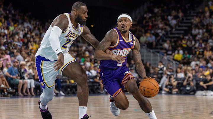 Oct 6, 2024; Palm Desert, California, USA;  Phoenix Suns guard Bradley Beal (3) moves the ball against Los Angeles Lakers forward LeBron James (23) during the first half at Acrisure Arena. Mandatory Credit: David Frerker-Imagn Images