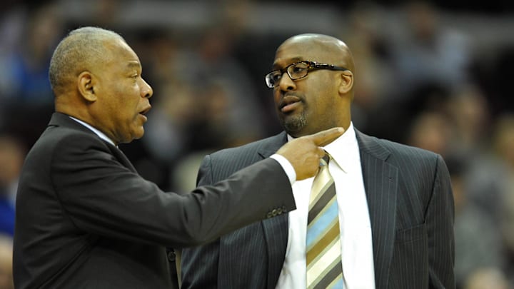 Mar 20, 2014; Cleveland, OH, USA; Cleveland Cavaliers head coach Mike Brown (right) talks with assistant Bernie Bickerstaff against the Oklahoma City Thunder at Quicken Loans Arena. Oklahoma City won 102-95. Mandatory Credit: David Richard-Imagn Images