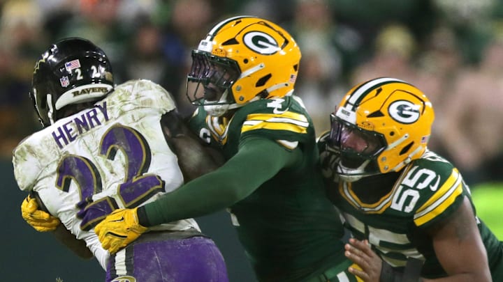 Green Bay Packers linebacker Quay Walker (7) and defensive end Kingsley Enagbare (55) tackle Baltimore Ravens running back Derrick Henry (22) on Saturday, December 27, 2025, at Lambeau Field in Green Bay, Wis. The Ravens defeated the Packers 41-24.
Wm. Glasheen USA TODAY NETWORK-Wisconsin