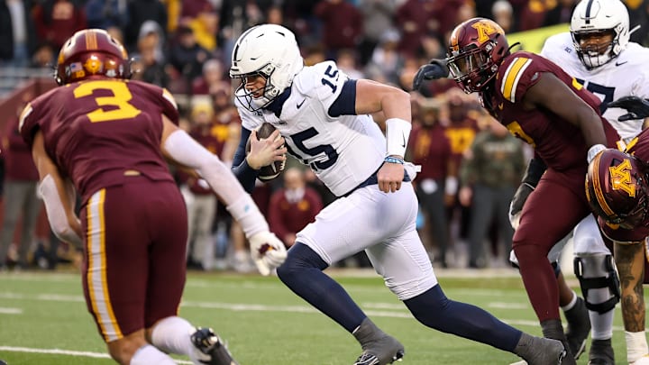 Penn State Nittany Lions quarterback Drew Allar (15) runs the ball against the Minnesota Golden Gophers during the second quarter at Huntington Bank Stadium. 