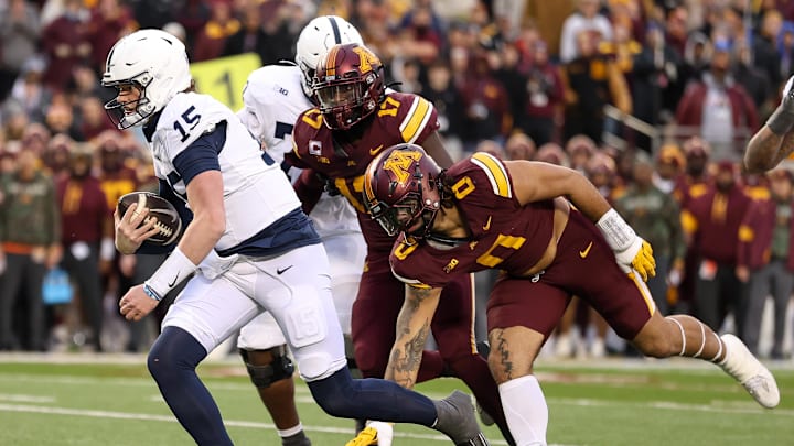 Penn State Nittany Lions quarterback Drew Allar (15) runs the ball against the Minnesota Golden Gophers during the second quarter at Huntington Bank Stadium.