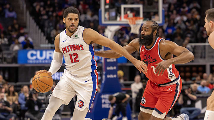 Feb 24, 2025; Detroit, Michigan, USA; Detroit Pistons forward Tobias Harris (12) moves the ball up court in front of LA Clippers guard James Harden (1) during the first half at Little Caesars Arena. Mandatory Credit: David Reginek-Imagn Images