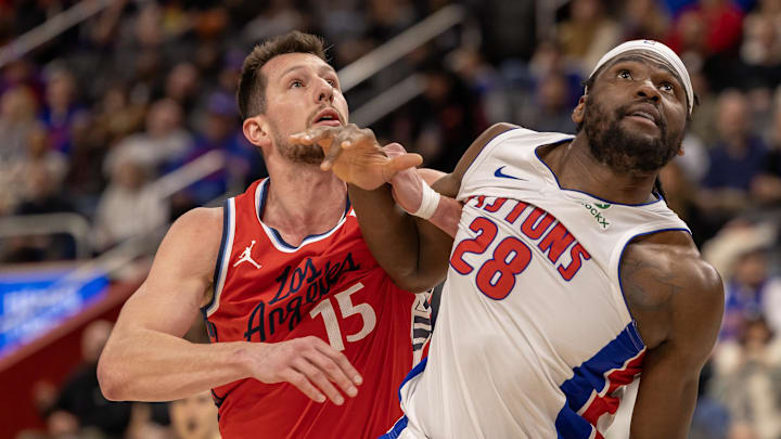 Feb 24, 2025; Detroit, Michigan, USA; Detroit Pistons center Isaiah Stewart (28) battles for position with LA Clippers forward Drew Eubanks (15) during the second half at Little Caesars Arena. Mandatory Credit: David Reginek-Imagn Images