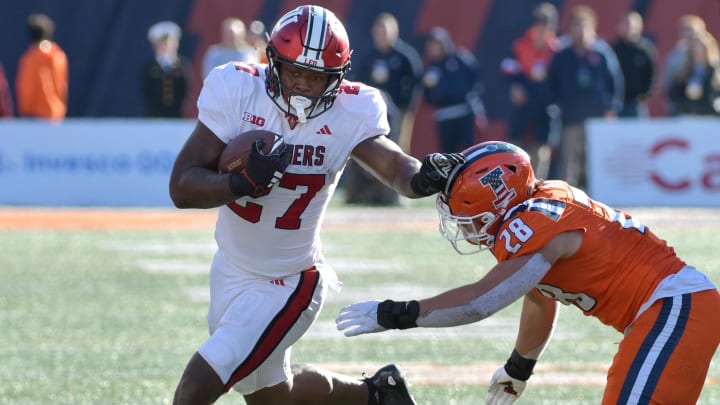Nov 11, 2023; Champaign, Illinois, USA; Indiana Hoosiers running back Trent Howland is pursued by Illinois Fighting Illini linebacker Dylan Rosiek (28) during the second half at Memorial Stadium. Mandatory Credit: Ron Johnson-USA TODAY Sports Nov 11, 2023; Champaign, Illinois, USA; Indiana Hoosiers running back Trent Howland is pursued by Illinois Fighting Illini linebacker Dylan Rosiek (28) during the second half at Memorial Stadium. Mandatory Credit: Ron Johnson-USA TODAY Sports