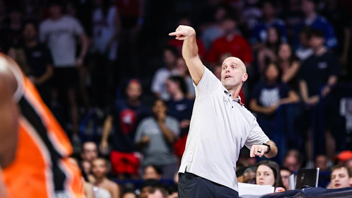 Feb 7, 2026; Tucson, Arizona, USA; Oklahoma State Cowboys head coach Steve Lutz yells out to his players during the first half of the game against the Arizona Wildcats at McKale Memorial Center. Mandatory Credit: Aryanna Frank-Imagn Images