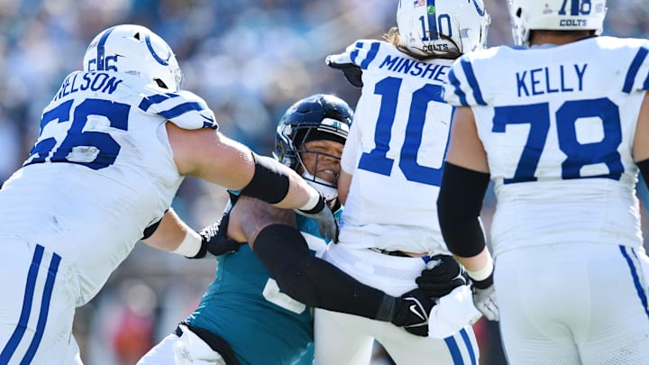 Jacksonville Jaguars defensive end Roy Robertson-Harris (95) makes a hit on Indianapolis Colts quarterback Gardner Minshew (10) during late fourth quarter action. The Jacksonville Jaguars hosted the Indianapolis Colts at EverBank Stadium in Jacksonville, FL Sunday, October 15, 2023. The Jaguars ended the first half with a 21 to 6 lead and won with a final score of 37 to 20.