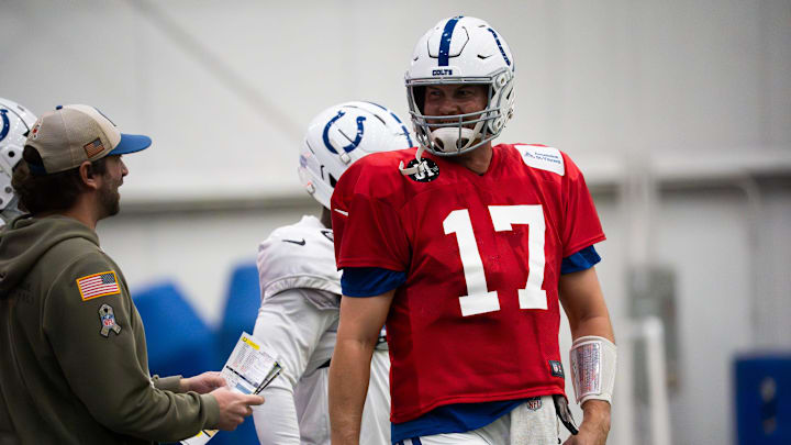 Indianapolis Colts quarterback Philip Rivers talks with quarterbacks coach Cam Turner Indianapolis Colts quarterback Philip Rivers talks with quarterbacks coach Cam Turner