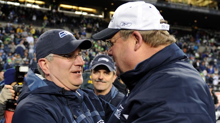 Seattle Seahawks CEO Tod Leiweke, left, congratulates coach Mike Holmgren.