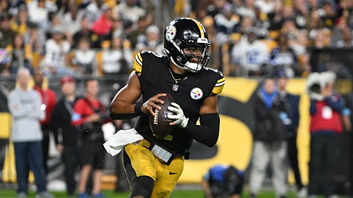 Oct 6, 2024; Pittsburgh, Pennsylvania, USA; Pittsburgh Steelers quarterback Justin Fields (2) scrambles against the Dallas Cowboys during the first quarter at Acrisure Stadium. Mandatory Credit: Barry Reeger-Imagn Images