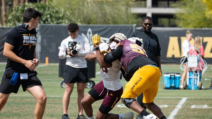 Defensive lineman Clayton Smith (10) and Offensive lineman Josh Atkins (53) run through drills at Sun Devils spring football practice at Kajikawa Practice fields on April 1, 2025, in Tempe, Ariz. Defensive lineman Clayton Smith (10) and Offensive lineman Josh Atkins (53) run through drills at Sun Devils spring football practice at Kajikawa Practice fields on April 1, 2025, in Tempe, Ariz.