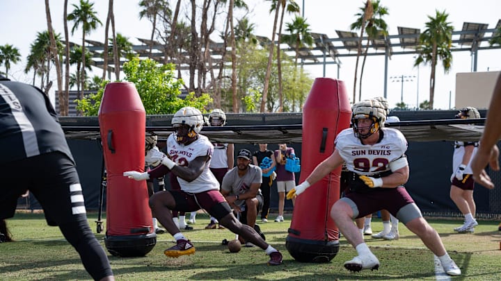 Defensive lineman Prince Dorbah (32) and Zac Swanson (92) run through drills with the defensive line at Sun Devils spring football practice at Kajikawa Practice fields on April 1, 2025, in Tempe, Ariz. Defensive lineman Prince Dorbah (32) and Zac Swanson (92) run through drills with the defensive line at Sun Devils spring football practice at Kajikawa Practice fields on April 1, 2025, in Tempe, Ariz.