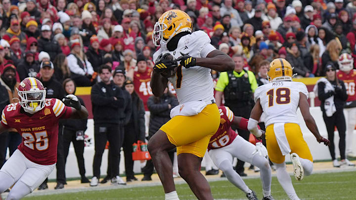Arizona State Sun Devils tight end Chamon Metayer (7) makes a catch around Iowa State Cyclones' defensive back Josh Patterson (25) during the first quarter in the Big-12 showdown at jack Trice Stadium on Nov. 1, 2025, in Ames, Iowa.