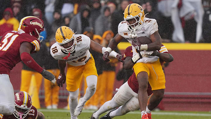 Arizona State Sun Devils running back Raleek Brown (3) battles for a few yards as getting tackle by Iowa State Cyclones' defensive back Josh Patterson (25) after making a first down during the fourth quarter in the Big-12 showdown at jack Trice Stadium on Nov. 1, 2025, in Ames, Iowa.