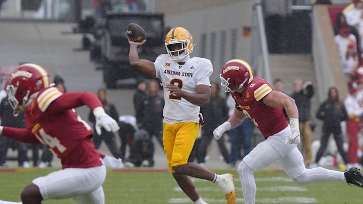 Arizona State Sun Devils quarterback Jeff Sims (2) passes the ball around Iowa State Cyclones' linebacker Cael Brezina (9) during the second quarter in the Big-12 showdown at jack Trice Stadium on Nov. 1, 2025, in Ames, Iowa.