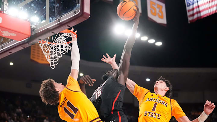 Gonzaga Bulldogs forward Graham Ike (15) slam-dunks the ball over Arizona State Sun Devils forward Kash Polk (11) on Nov. 14, 2025, at Desert Financial Arena in Tempe.