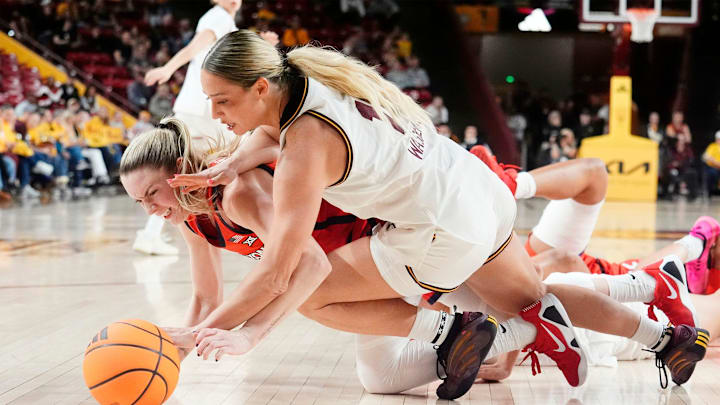 Arizona Wildcats guard Kamryn Kitchen (1) battles for the ball with Arizona State Sun Devils guard Marley Washenitz (11) on Jan. 28, 2026, at Desert Financial Arena in Tempe.
