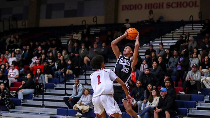 Serra's Maximo Adams (25) looks to pass while covered by Indio's Jerry Perkins (1) during the first quarter of their first-round CIF-SS playoff game at Indio High School in Indio, Calif., Wednesday, Feb. 7, 2024.