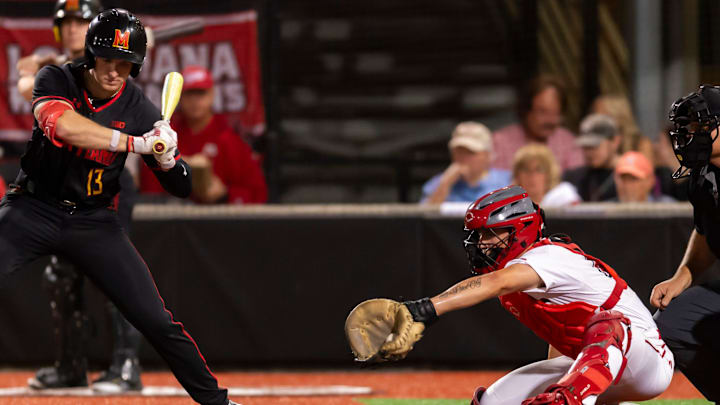 Colt Brown 45 is working behind the plate as Louisiana's Ragin' Cajuns baseball takes on Maryland. 