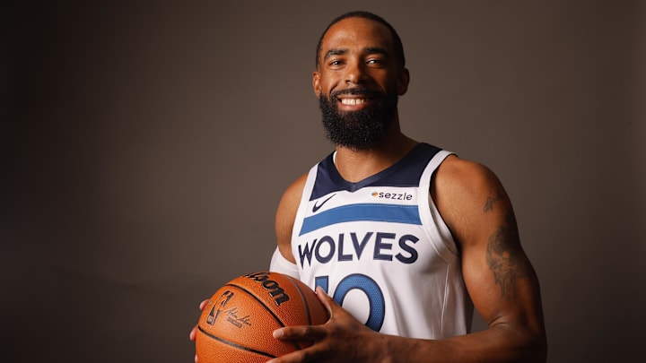 Minnesota Timberwolves guard Mike Conley (10) poses for photos on media day at Target Center in Minneapolis on Sept. 30, 2024.