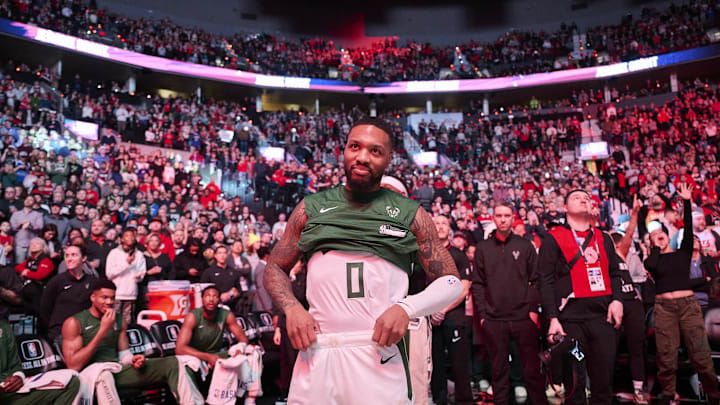 Jan 31, 2024; Portland, Oregon, USA; Milwaukee Bucks guard Damian Lillard (0) listens as fans applaud his return before a game against the Portland Trail Blazers at Moda Center. Mandatory Credit: Troy Wayrynen-Imagn Images