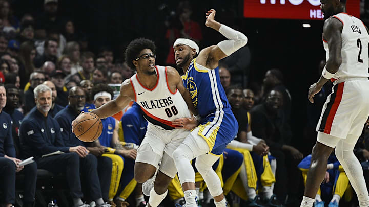 Apr 11, 2024; Portland, Oregon, USA; Portland Trail Blazers guard Scoot Henderson (00) looks to pass the ball during the first half against Golden State Warriors guard Moses Moody (4) at Moda Center. Mandatory Credit: Troy Wayrynen-Imagn Images Apr 11, 2024; Portland, Oregon, USA; Portland Trail Blazers guard Scoot Henderson (00) looks to pass the ball during the first half against Golden State Warriors guard Moses Moody (4) at Moda Center. Mandatory Credit: Troy Wayrynen-Imagn Images