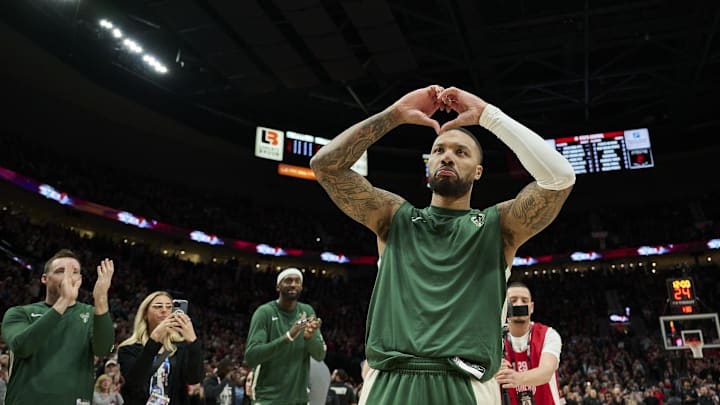 Jan 31, 2024; Portland, Oregon, USA; Milwaukee Bucks guard Damian Lillard (0) shows his love for Portland fans during introductions before a game against the Portland Trail Blazers at Moda Center. Mandatory Credit: Troy Wayrynen-Imagn Images