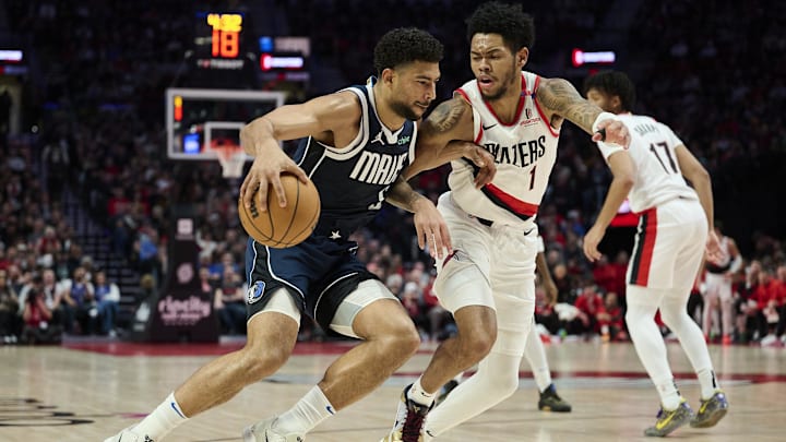 Dec 28, 2024; Portland, Oregon, USA; Dallas Mavericks guard Quentin Grimes (5) drives to the basket during the first half against Portland Trail Blazers guard Anfernee Simons (1) at Moda Center. Mandatory Credit: Troy Wayrynen-Imagn Images Dec 28, 2024; Portland, Oregon, USA; Dallas Mavericks guard Quentin Grimes (5) drives to the basket during the first half against Portland Trail Blazers guard Anfernee Simons (1) at Moda Center. Mandatory Credit: Troy Wayrynen-Imagn Images