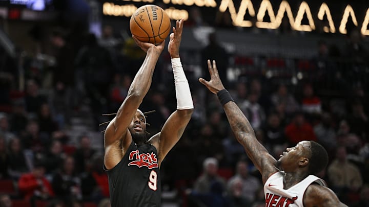 Feb 27, 2024; Portland, Oregon, USA; Portland Trail Blazers forward Jerami Grant (9) shoots a basket during the first half against Miami Heat guard Terry Rozier (2) at Moda Center. Mandatory Credit: Troy Wayrynen-Imagn Images