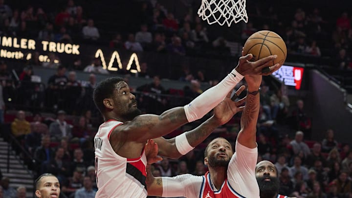 Jan 16, 2025; Portland, Oregon, USA; Portland Trail Blazers center Deandre Ayton (2) reaches for the ball during the second half against LA Clippers guard Norman Powell (24) at Moda Center. Mandatory Credit: Troy Wayrynen-Imagn Images