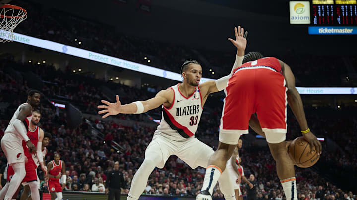Jan 16, 2025; Portland, Oregon, USA;Portland Trail Blazers forward Toumani Camara (33) guards LA Clippers guard James Harden (1) during the first half at Moda Center. Mandatory Credit: Troy Wayrynen-Imagn Images
