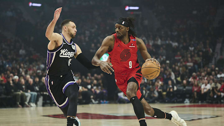 Feb 6, 2025; Portland, Oregon, USA; Portland Trail Blazers forward Jerami Grant (9) drives to the basket the ball during the first half against Sacramento Kings guard Zach LaVine (8) at Moda Center. Mandatory Credit: Troy Wayrynen-Imagn Images