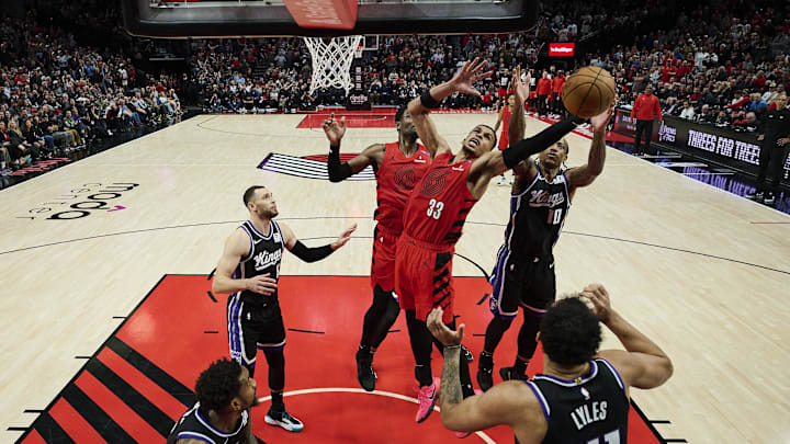 Feb 6, 2025; Portland, Oregon, USA; Portland Trail Blazers forward Toumani Camara (33) grabs a rebound during the second half against Sacramento Kings forward DeMar DeRozan (10) at Moda Center. Mandatory Credit: Troy Wayrynen-Imagn Images Feb 6, 2025; Portland, Oregon, USA; Portland Trail Blazers forward Toumani Camara (33) grabs a rebound during the second half against Sacramento Kings forward DeMar DeRozan (10) at Moda Center. Mandatory Credit: Troy Wayrynen-Imagn Images