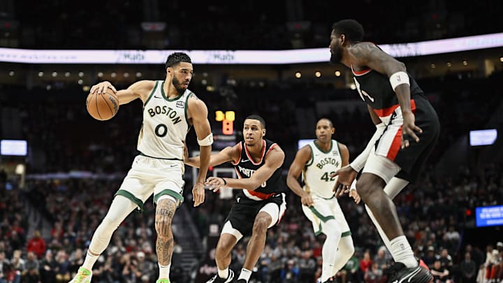 Mar 11, 2024; Portland, Oregon, USA; Boston Celtics forward Jayson Tatum (0) drives to the basket during the first half against Portland Trail Blazers forward Kris Murray (8) and center Deandre Ayton (2) at Moda Center. Mandatory Credit: Troy Wayrynen-Imagn Images Mar 11, 2024; Portland, Oregon, USA; Boston Celtics forward Jayson Tatum (0) drives to the basket during the first half against Portland Trail Blazers forward Kris Murray (8) and center Deandre Ayton (2) at Moda Center. Mandatory Credit: Troy Wayrynen-Imagn Images