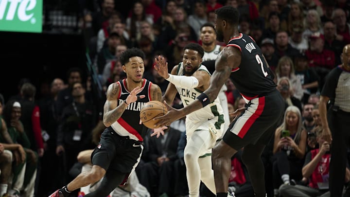 Jan 31, 2024; Portland, Oregon, USA; Portland Trail Blazers center Deandre Ayton (2) hands the ball to guard Anfernee Simons (1) during the first half against Milwaukee Bucks guard Malik Beasley (5) at Moda Center. Mandatory Credit: Troy Wayrynen-Imagn Images Jan 31, 2024; Portland, Oregon, USA; Portland Trail Blazers center Deandre Ayton (2) hands the ball to guard Anfernee Simons (1) during the first half against Milwaukee Bucks guard Malik Beasley (5) at Moda Center. Mandatory Credit: Troy Wayrynen-Imagn Images
