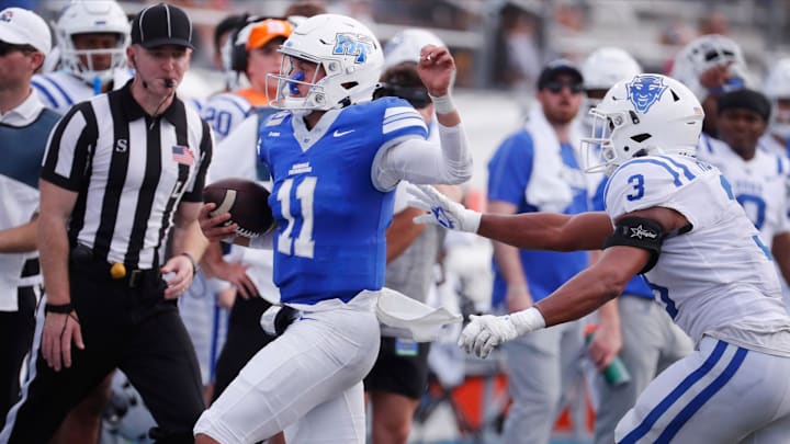 Middle Tennessee quarterback Nicholas Vattiato (11) runs out of bounds as he runs the option while Duke linebacker Alex Howard (3) covers him during the MTSU Homecoming game against Duke, on Saturday, Sept. 21, 2024.