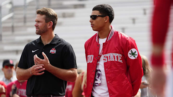 Sep 16, 2023; Columbus, Ohio, USA; Ohio State Buckeyes quarterbacks coach Corey Dennis stands with recruit Tavien St. Clair of Bellefontaine during the NCAA football game at Ohio Stadium. Sep 16, 2023; Columbus, Ohio, USA; Ohio State Buckeyes quarterbacks coach Corey Dennis stands with recruit Tavien St. Clair of Bellefontaine during the NCAA football game at Ohio Stadium.