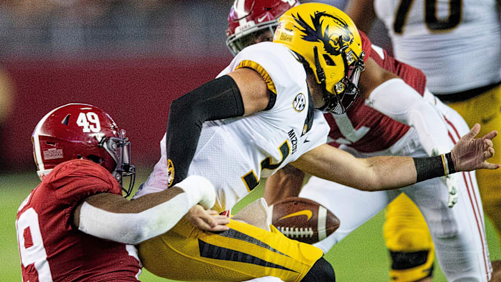 Alabama defensive lineman Isaiah Buggs (49) sacks Missouri quarterback Drew Lock (3) causing him to fumble the ball in first half action at Bryant Denny Stadium in Tuscaloosa, Ala., on Saturday October 13, 2018