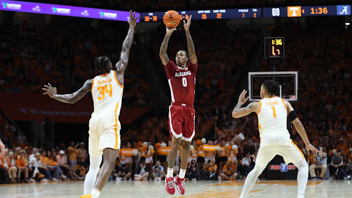 Feb 28, 2026; Knoxville, Tennessee, USA;  Alabama Crimson Tide guard Labaron Philon (0) shoots the ball against Tennessee Volunteers center Felix Okpara (34) during the second half at Thompson-Boling Arena at Food City Center. Mandatory Credit: Randy Sartin-Imagn Images
