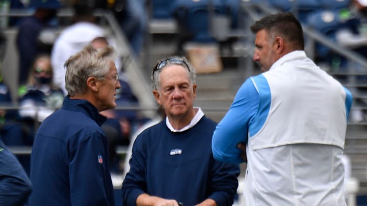 Seattle Seahawks head coach Pete Carroll, left, talks to Tennessee Titans head coach Mike Vrabel before a game on Sept. 19, 2021