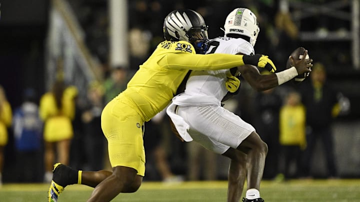 Oct 4, 2024; Eugene, Oregon, USA; Oregon Ducks defensive end Jordan Burch (1) sacks Michigan State Spartans quarterback Aidan Chiles (2) during the second half at Autzen Stadium.